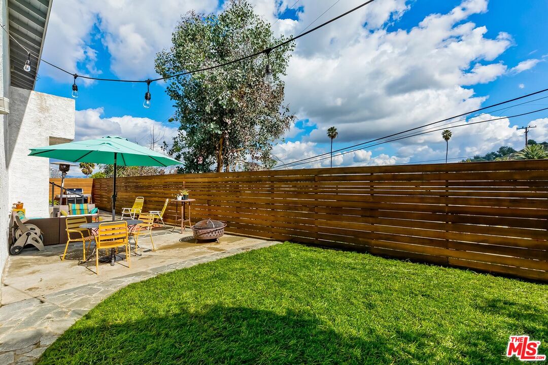 3838 Crestview Road Culver City, CA 90232 - Photo 41 of 53 a view of a bench in a backyard