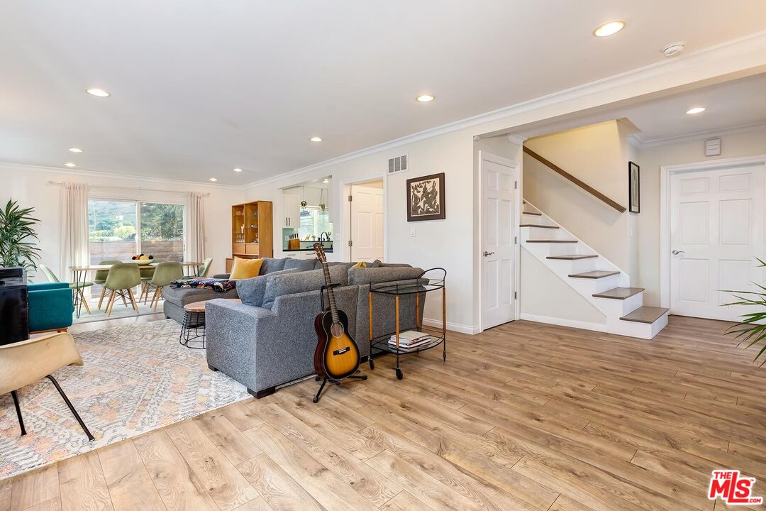 3838 Crestview Road Culver City, CA 90232 - Photo 7 of 53 a living room with furniture and wooden floor