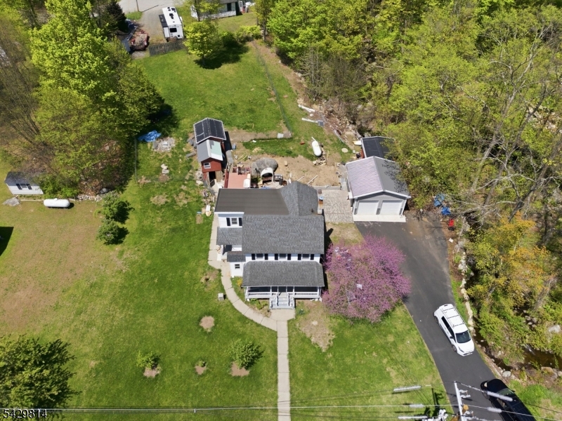 251 Russia Road Oak Ridge, NJ 07438 - Photo 34 of 34 an aerial view of a house with outdoor space pool seating area and yard