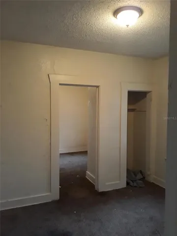 an empty room with wooden floor