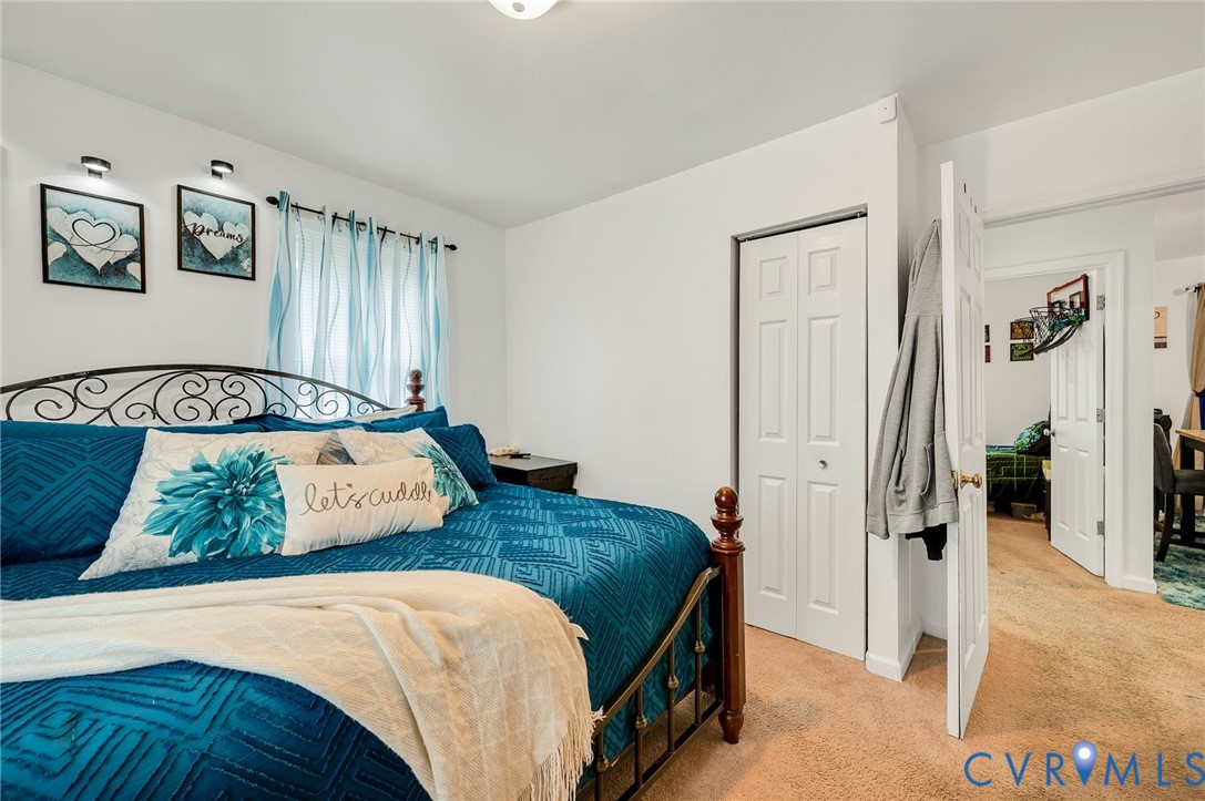 2909 Springview Drive Richmond, VA 23234 - Photo 14 of 19 a bedroom with a large bed and a couch