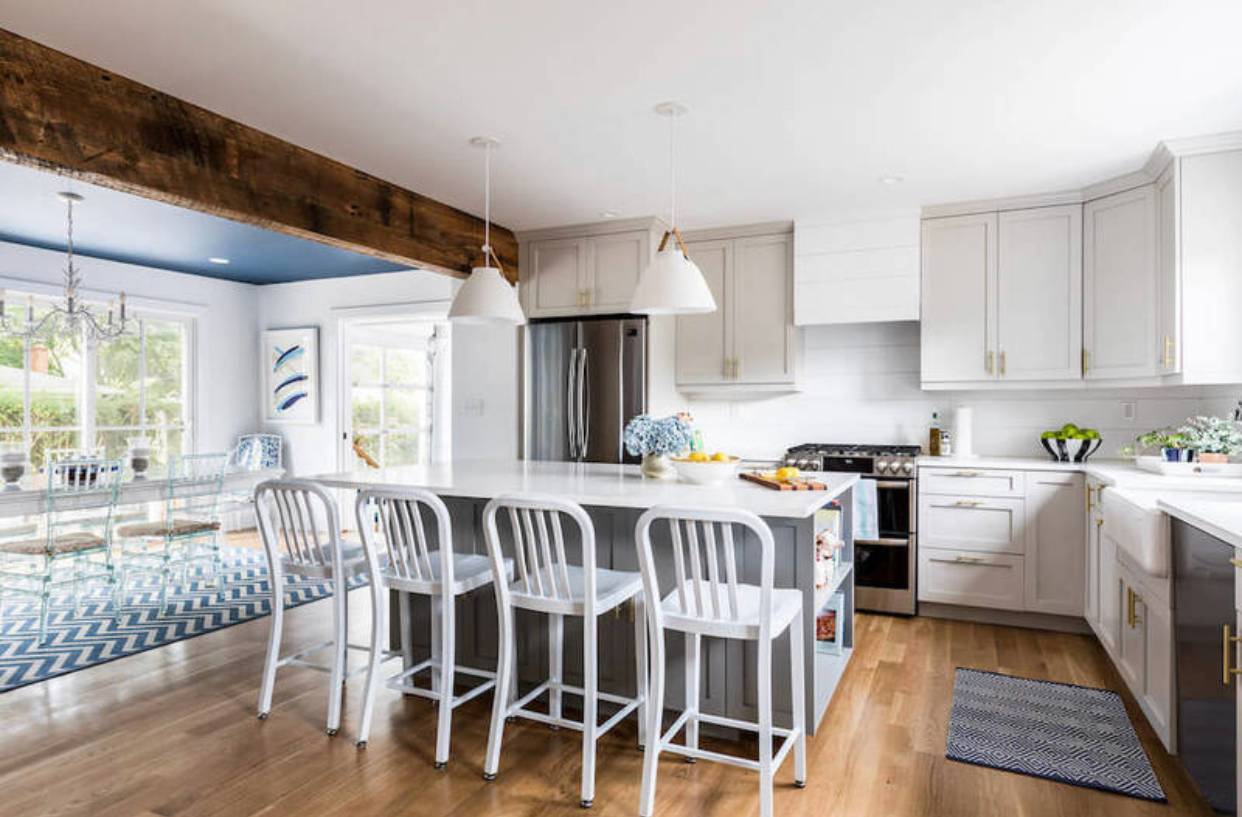 12 Hildreth Place Hampton Bays, NY 11946 - Photo 2 of 7 a large white kitchen with sink and cabinets
