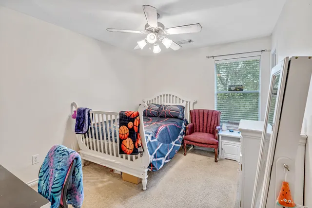 a bedroom with furniture and a window