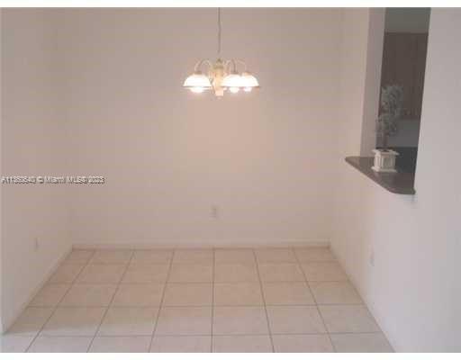 970 Abaco Lane Riviera Beach, FL 33404 - Photo 14 of 50 a view of a chandelier fan