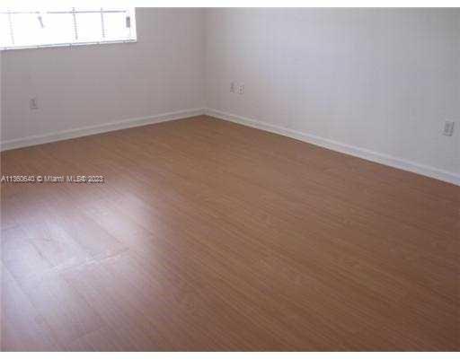 970 Abaco Lane Riviera Beach, FL 33404 - Photo 15 of 50 an empty room with wooden floor
