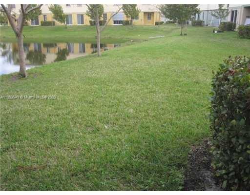 970 Abaco Lane Riviera Beach, FL 33404 - Photo 23 of 50 a view of a lake from a yard