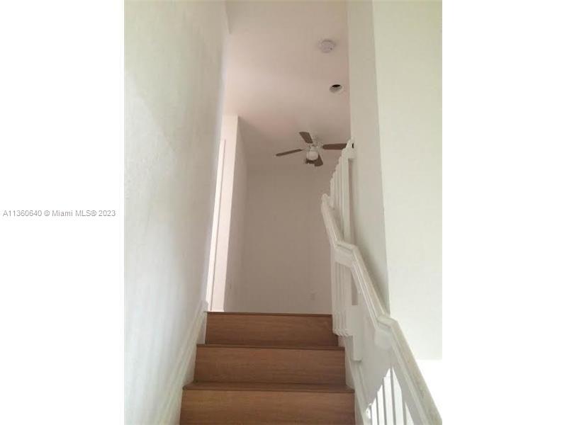 970 Abaco Lane Riviera Beach, FL 33404 - Photo 29 of 50 a view of a hallway with wooden floor