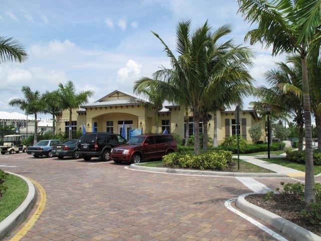 970 Abaco Lane Riviera Beach, FL 33404 - Photo 30 of 50 a front view of a house with swimming pool and sitting area