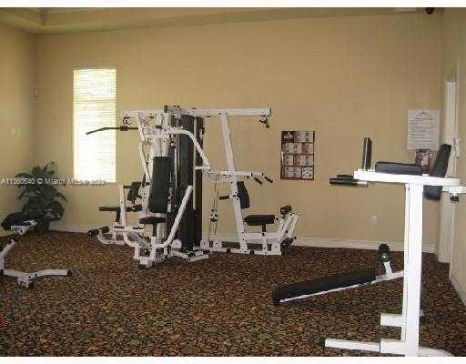 970 Abaco Lane Riviera Beach, FL 33404 - Photo 34 of 50 a view of a room with gym equipment