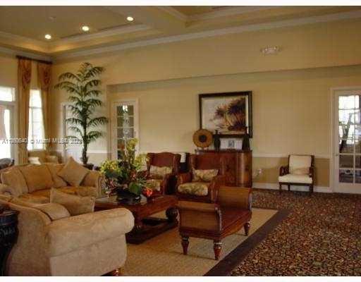 970 Abaco Lane Riviera Beach, FL 33404 - Photo 38 of 50 a living room with furniture and a potted plant