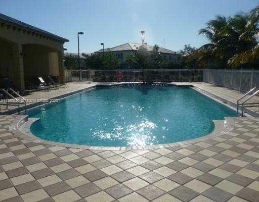 970 Abaco Lane Riviera Beach, FL 33404 - Photo 42 of 50 a view of a wooden deck with a yard