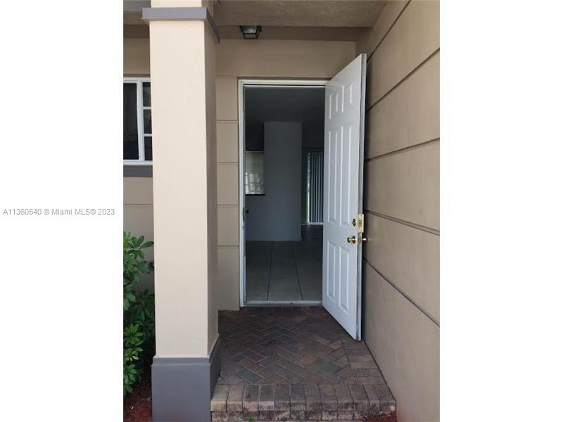 970 Abaco Lane Riviera Beach, FL 33404 - Photo 9 of 50 a view of a hallway with wooden floor