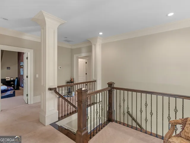 a living room with furniture hard wood floor and a rug