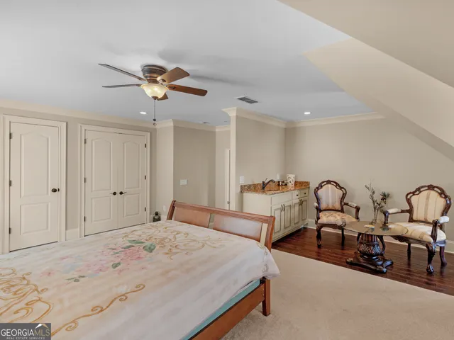 a living room with furniture rug and outdoor view