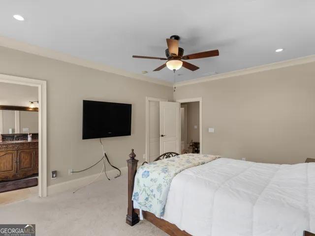 a view of a livingroom with a ceiling fan and a window