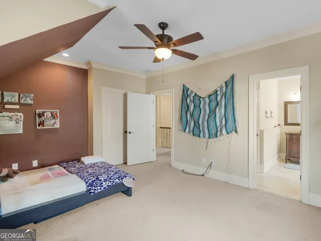 a spacious bathroom with a granite countertop tub and a large mirror