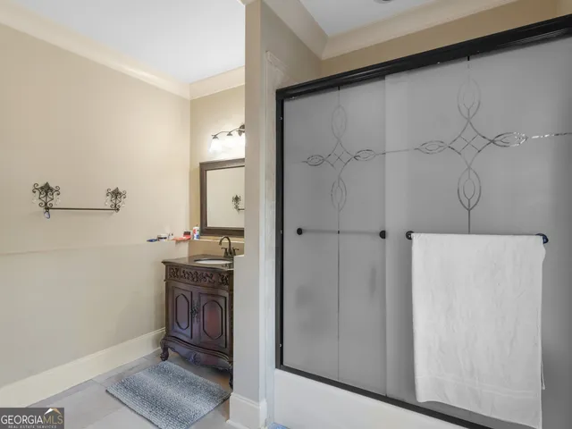 a bathroom with a sink a mirror and a toilet