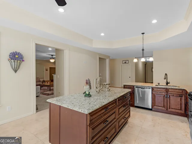 a kitchen with stainless steel appliances granite countertop a stove and a sink