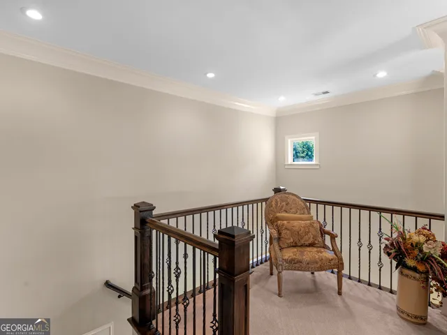 a kitchen with stainless steel appliances granite countertop a refrigerator a sink a stove and a sink with wooden floor