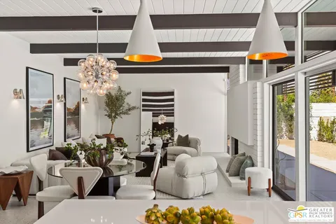 a view of a dining room with furniture window and outside view