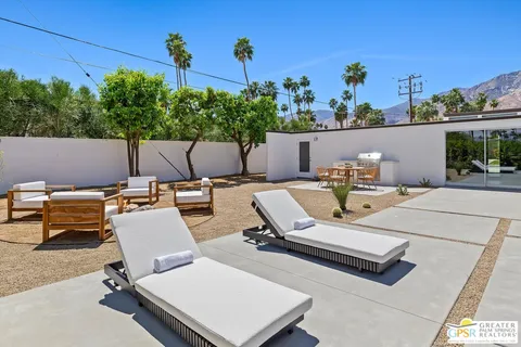 a outdoor living space with furniture and garden view