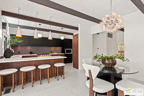 a view of living room filled with furniture and a potted plant
