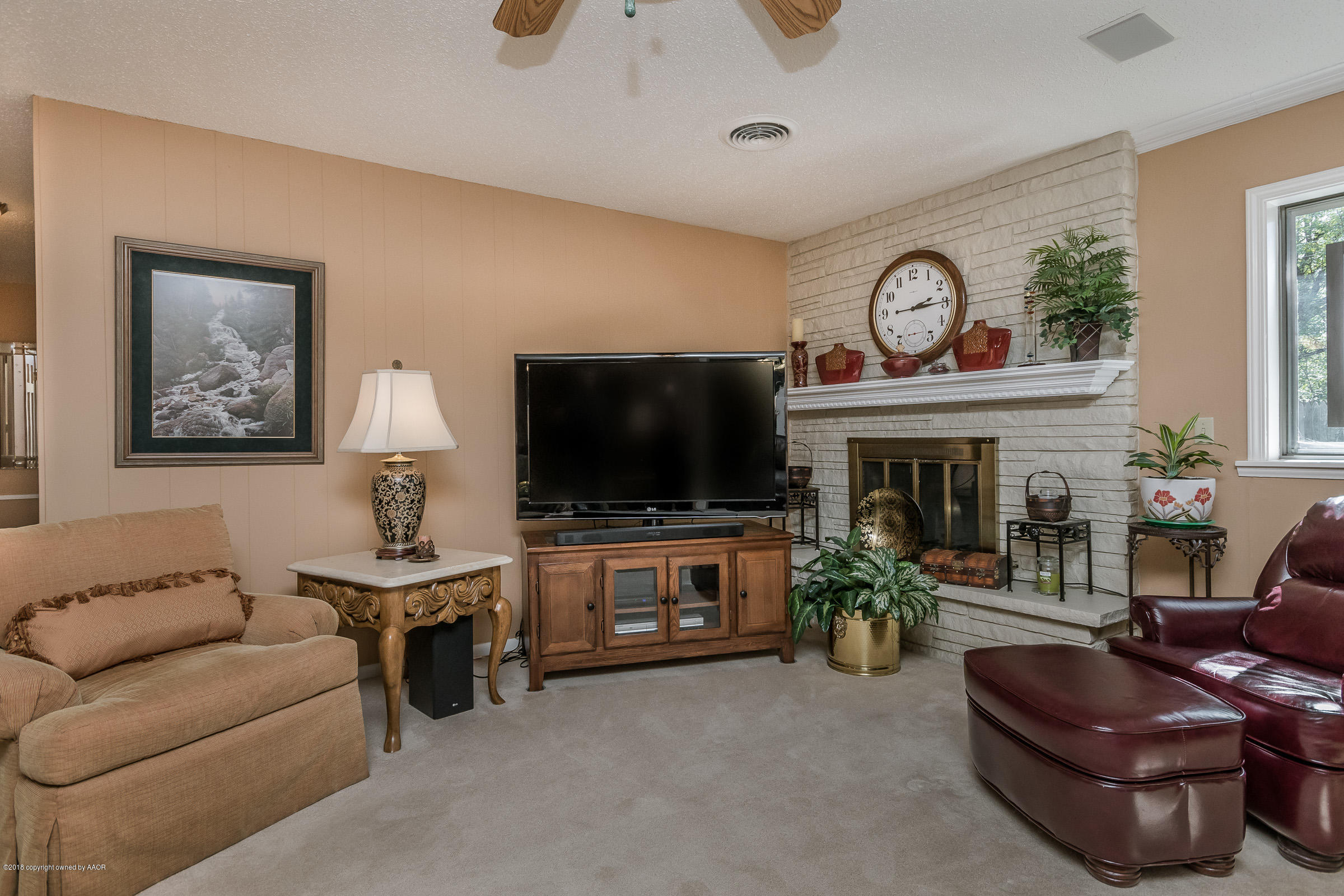 6709 Jameson Road Amarillo, TX 79106 - Photo 3 of 23 a living room with furniture and a flat screen tv
