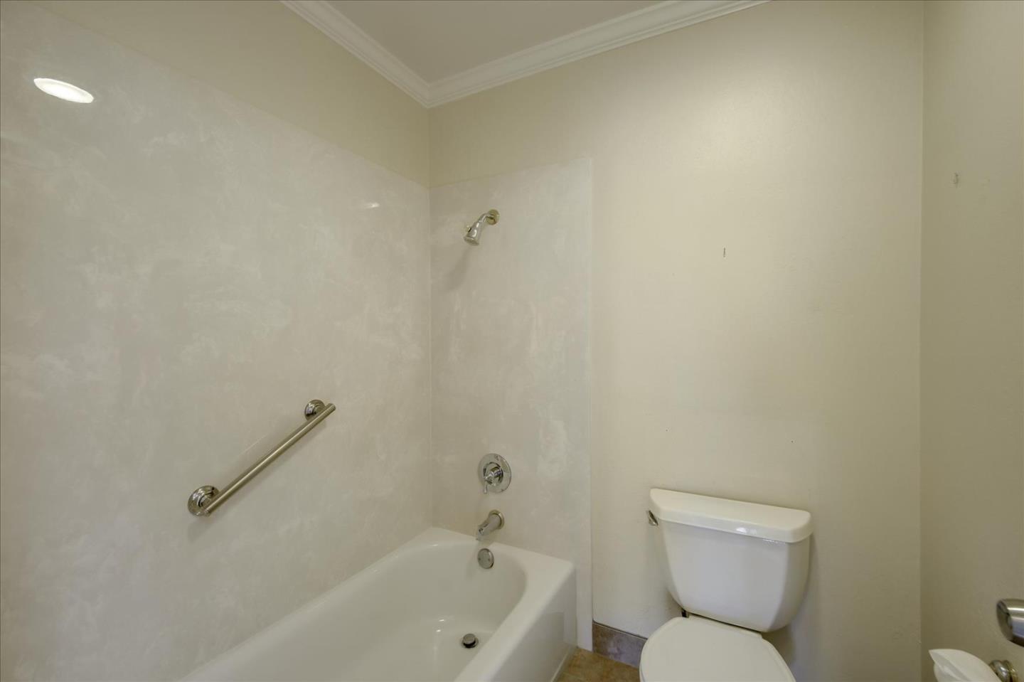 10854 Northview Square Cupertino, CA 95014 - Photo 11 of 18 a white toilet sitting next to a bath tub