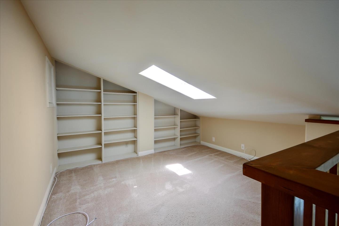 10854 Northview Square Cupertino, CA 95014 - Photo 12 of 18 a view of an empty room with a staircase