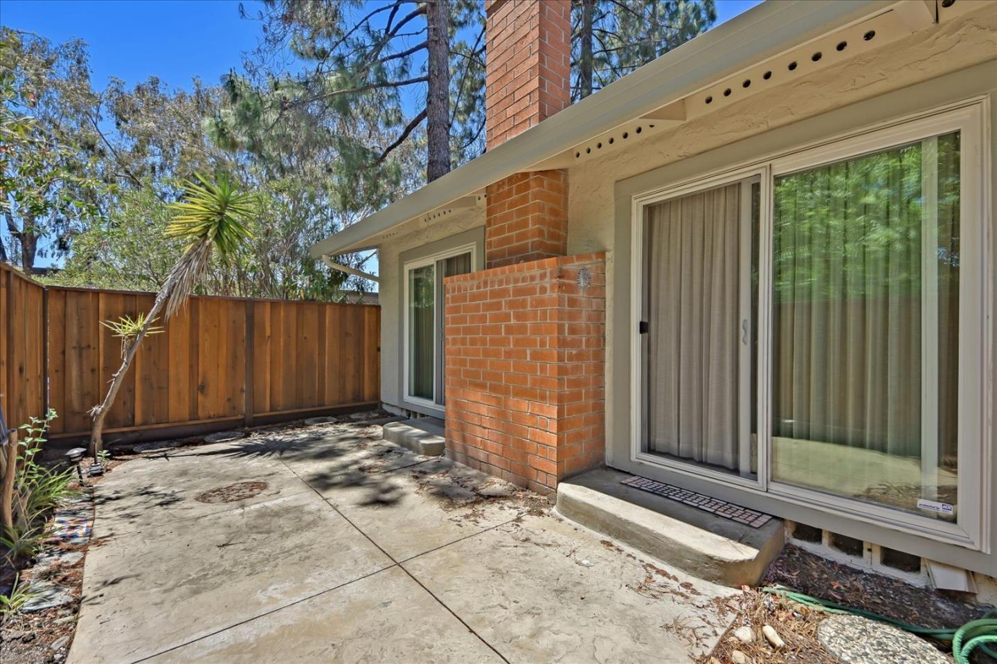 10854 Northview Square Cupertino, CA 95014 - Photo 18 of 18 a view of a house with backyard and wooden fence