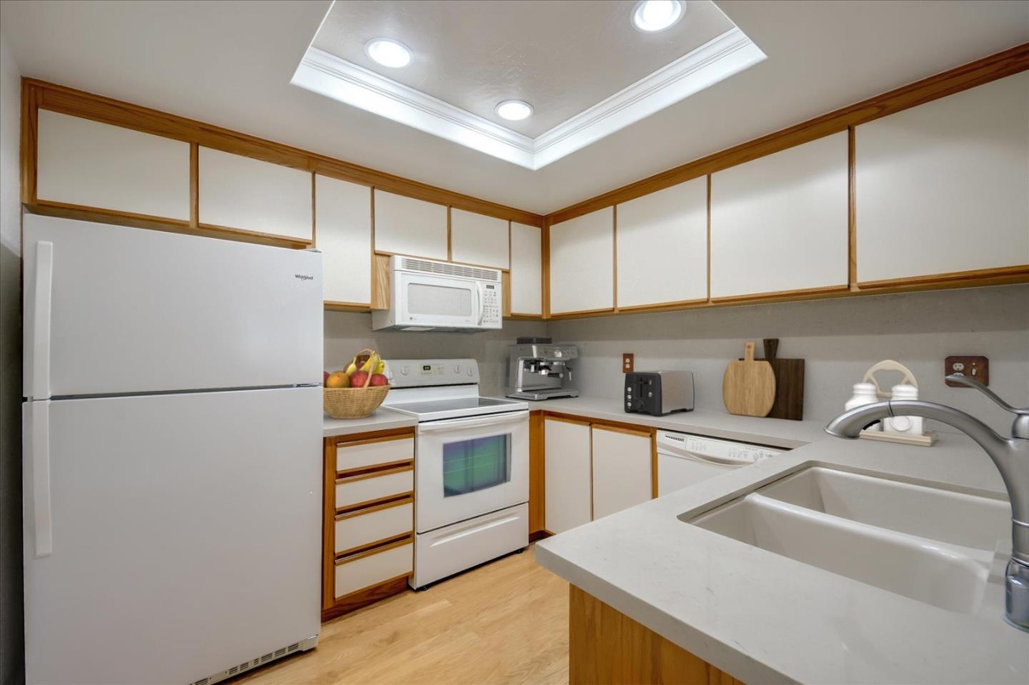 10854 Northview Square Cupertino, CA 95014 - Photo 4 of 18 a kitchen with stainless steel appliances a refrigerator sink and cabinets