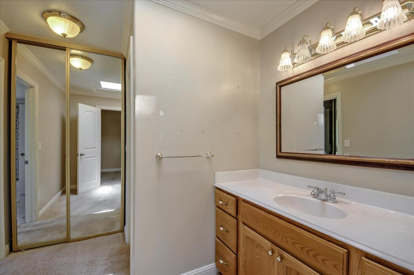 10854 Northview Square Cupertino, CA 95014 - Photo 10 of 18 a bathroom with a sink a vanity and a mirror
