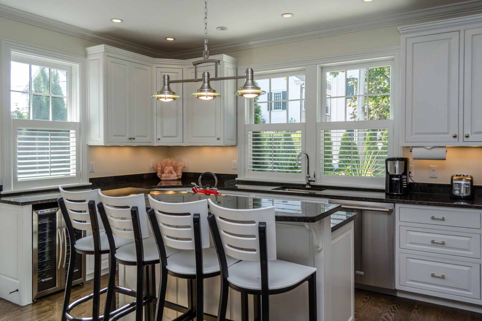 37 Simpsons Lane Edgartown, MA 02539 - Photo 8 of 28 a kitchen with a table chairs stove and cabinets