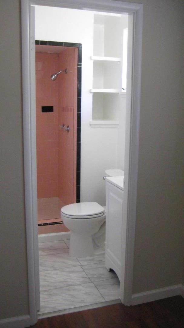 1765 Royal Avenue San Mateo, CA 94401 - Photo 8 of 16 a white toilet sitting next to a bathroom sink