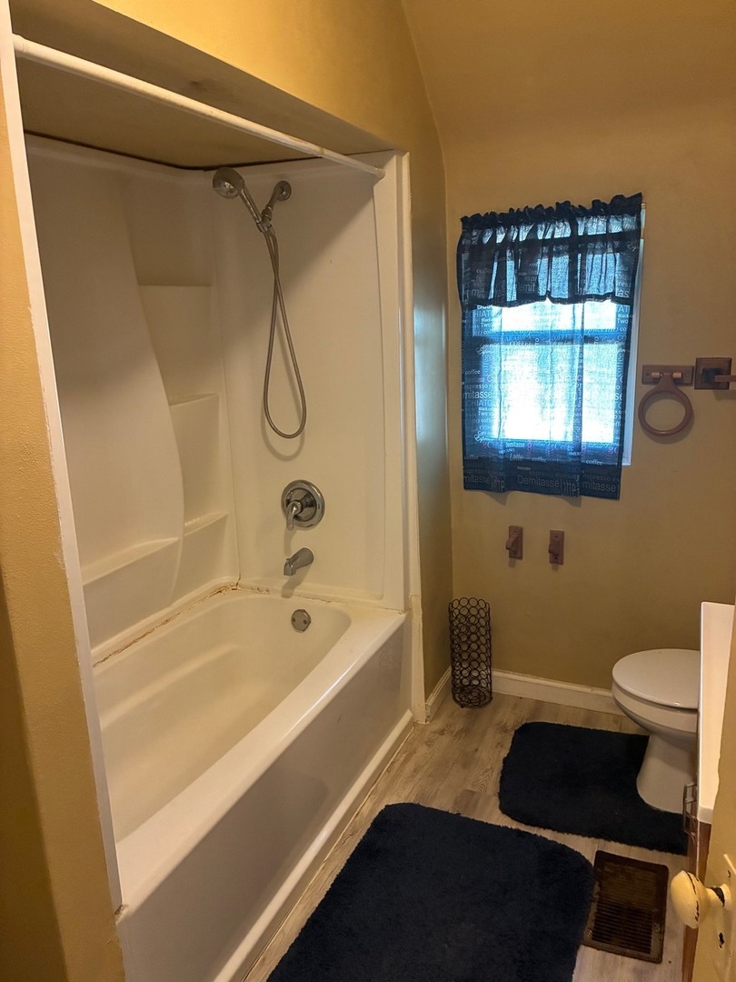 19 South 52nd Street Belleville, IL 62226 - Photo 3 of 7 a bathroom with a bathtub and a shower