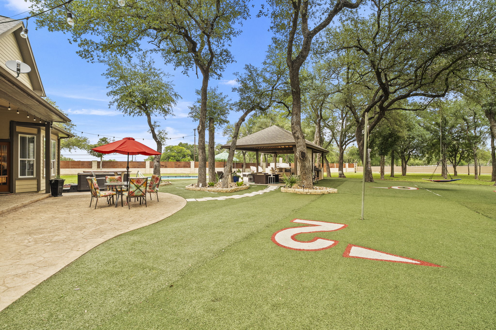 101 Landons Way Georgetown, TX 78633 - Photo 24 of 32 Turf area around the back of the house and towards the patio