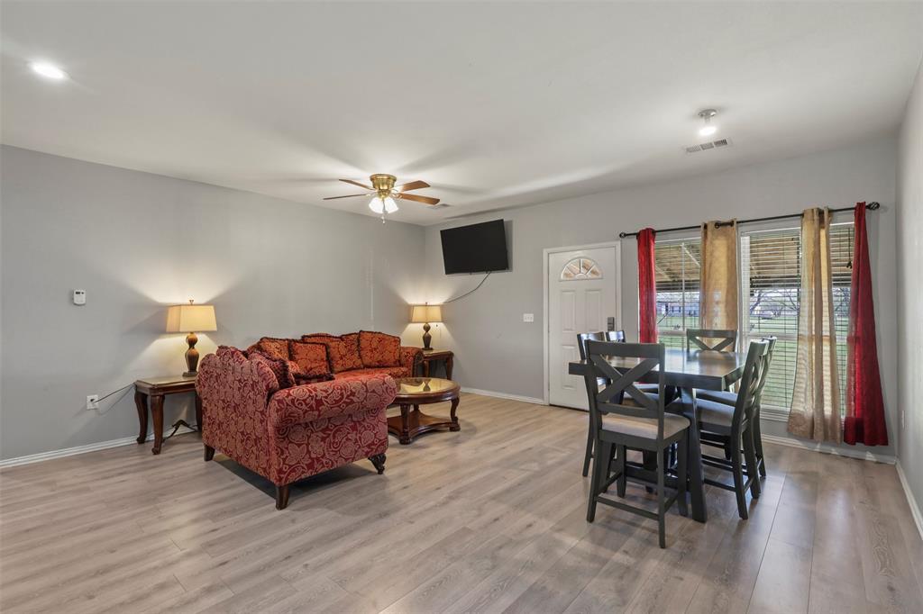 1556 John Wayne Road Kaufman, TX 75142 - Photo 6 of 33 a living room with furniture and wooden floor