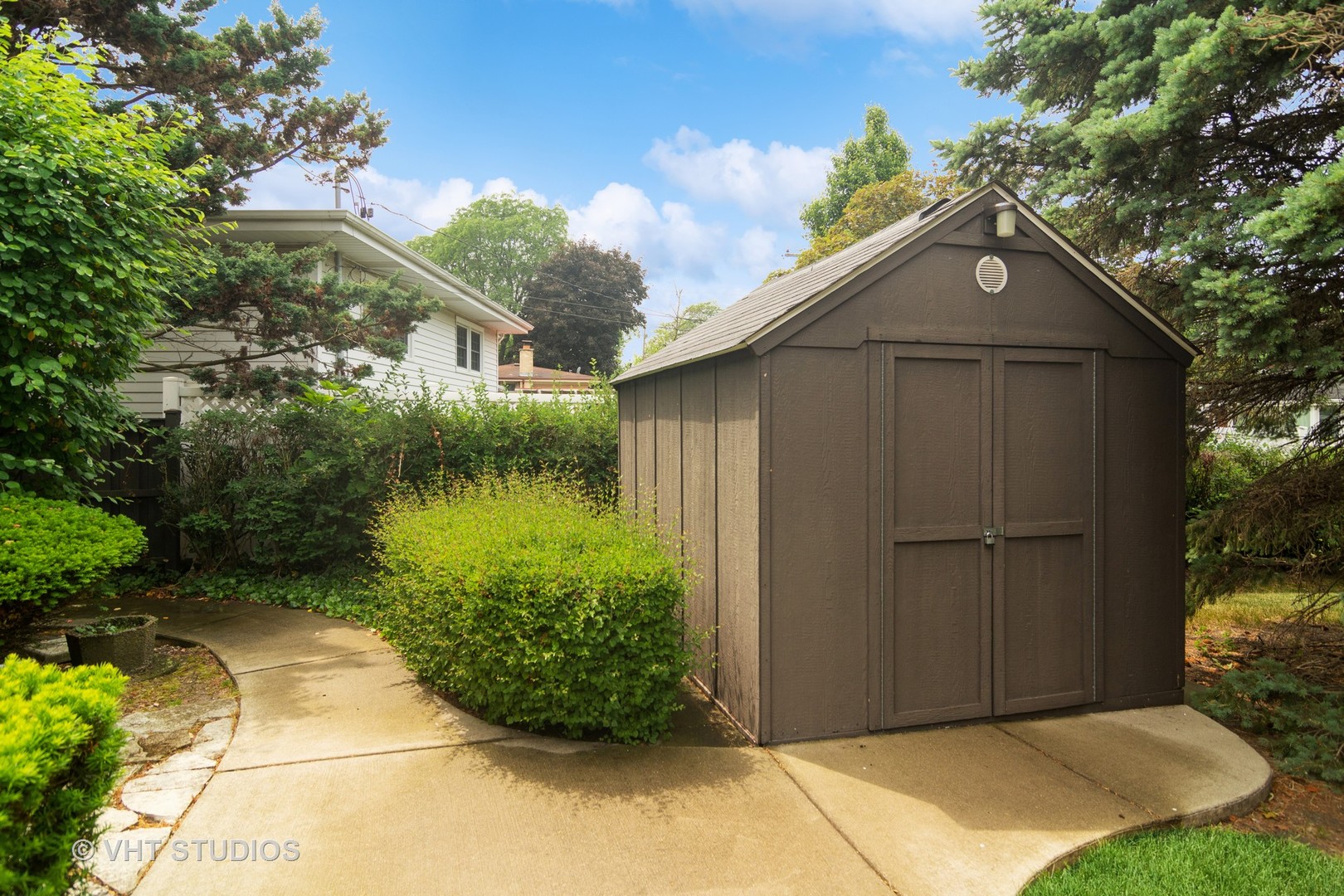 174 Lance Drive Des Plaines, IL 60016 - Photo 18 of 25 a backyard of a house with plants and entertaining space