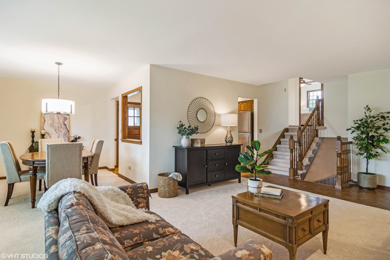 174 Lance Drive Des Plaines, IL 60016 - Photo 5 of 25 a living room with furniture a chandelier and a wooden floor