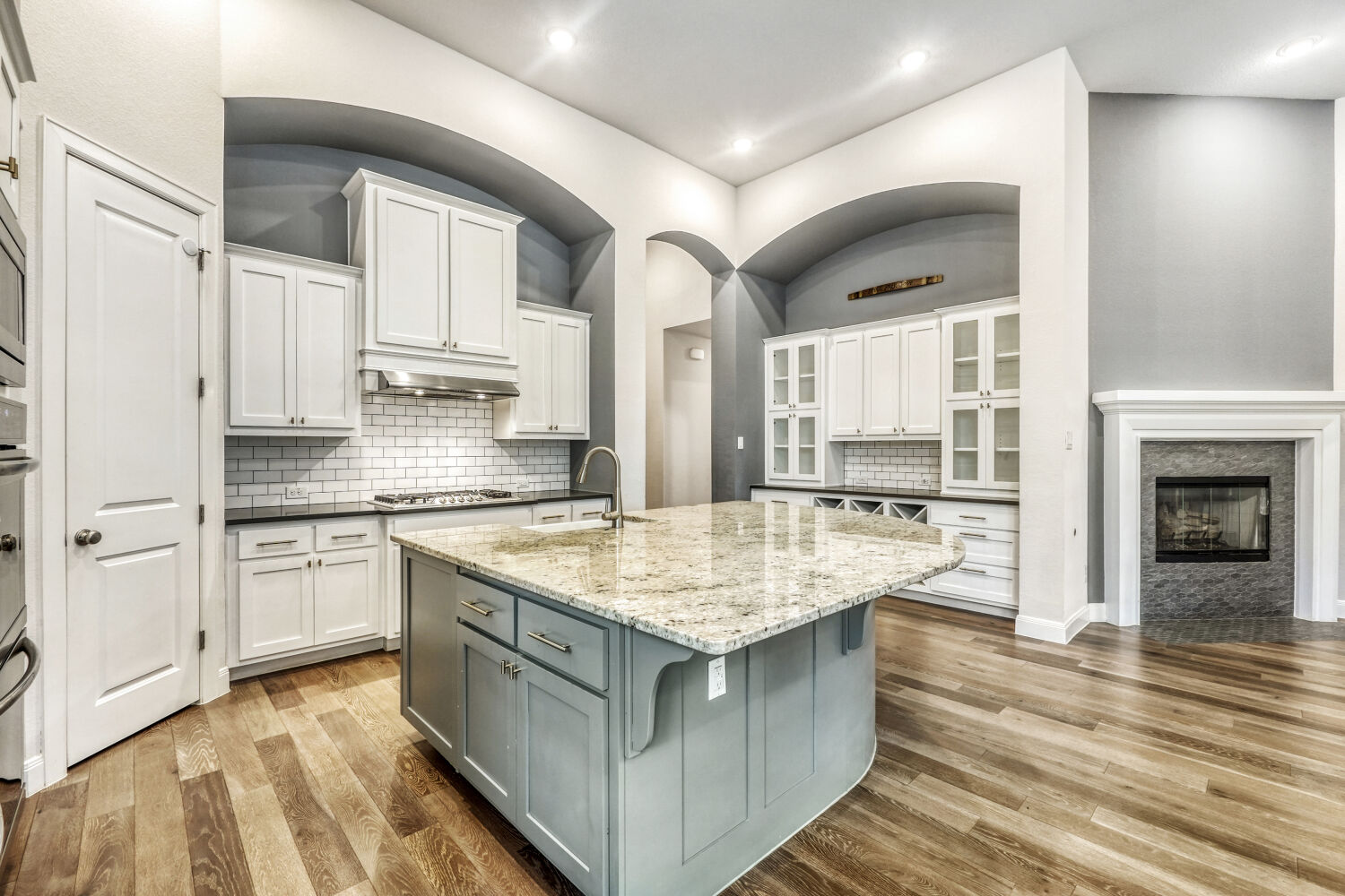 1401 Calago Cove Leander, TX 78641 - Photo 11 of 40 a kitchen with a sink stove and cabinets
