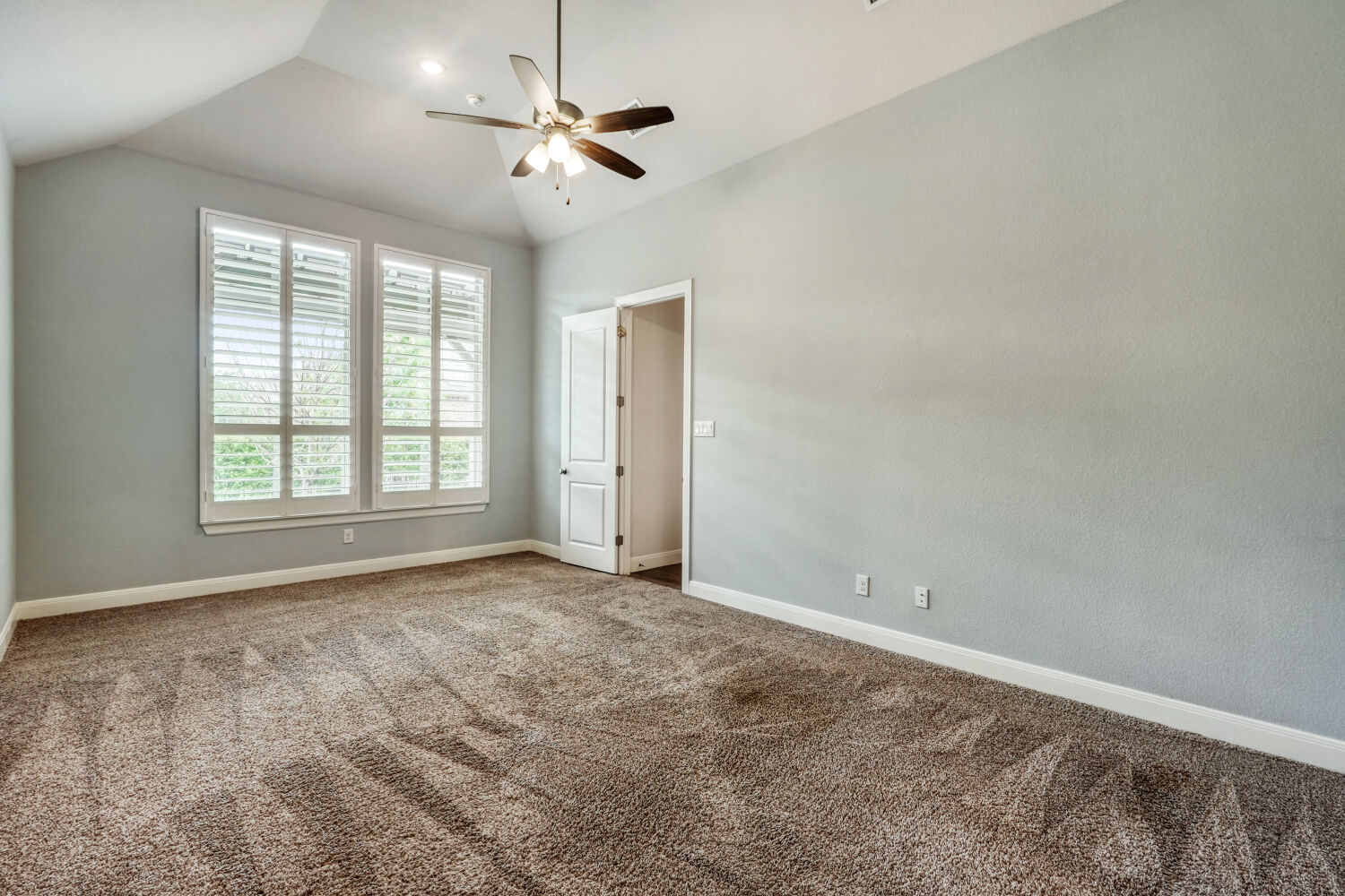 1401 Calago Cove Leander, TX 78641 - Photo 14 of 40 an empty room with windows and fan