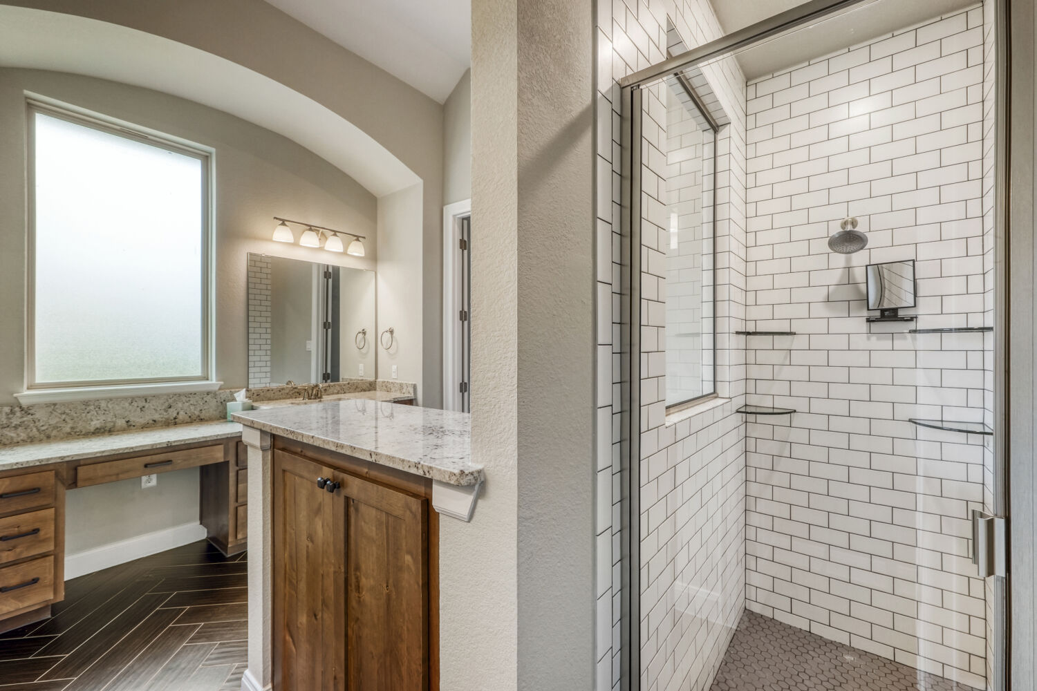 1401 Calago Cove Leander, TX 78641 - Photo 18 of 40 a bathroom with a granite countertop sink a mirror and a shower