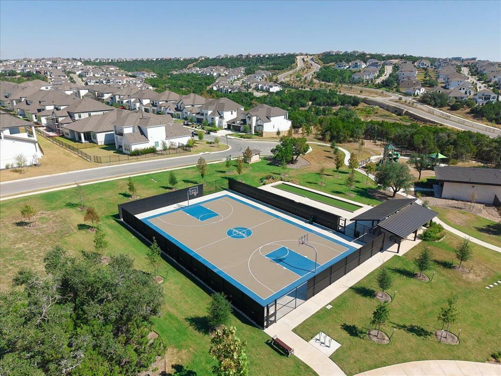 1401 Calago Cove Leander, TX 78641 - Photo 38 of 40 an aerial view of a tennis ground and a cars park