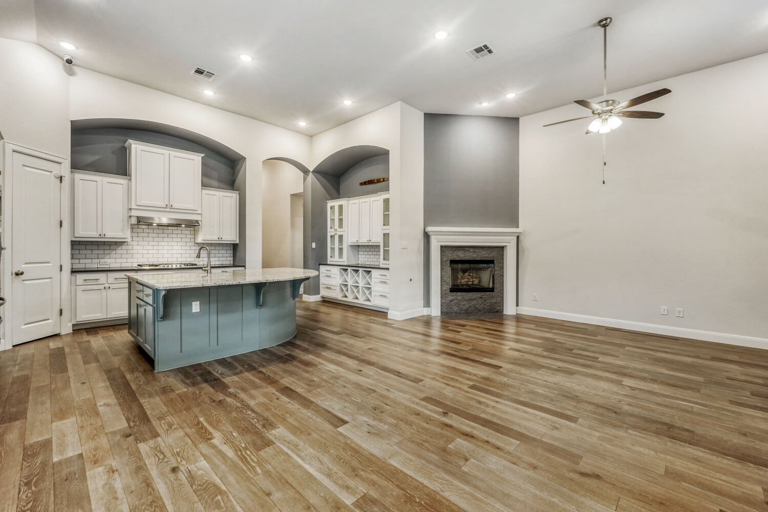 1401 Calago Cove Leander, TX 78641 - Photo 6 of 40 a kitchen with kitchen island a sink stainless steel appliances and cabinets