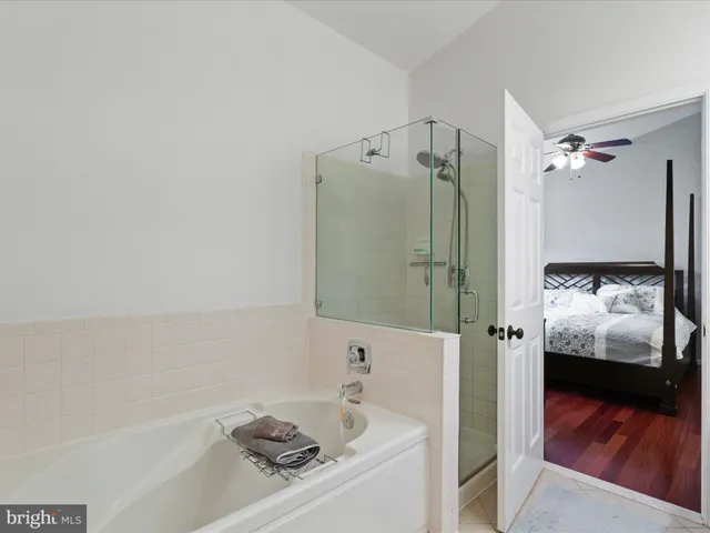 a bathroom with a tub and a sink