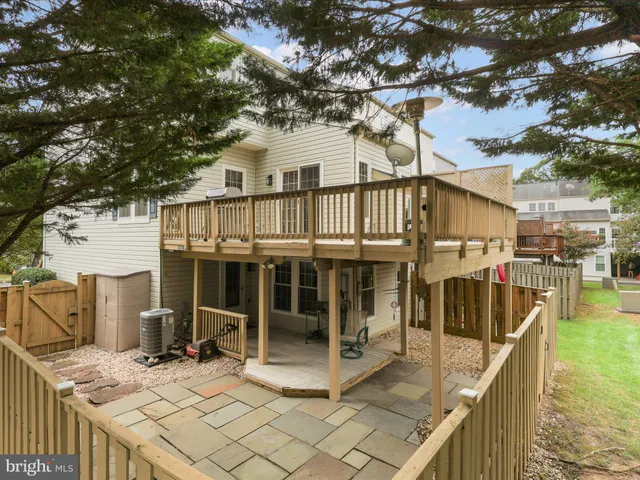 a view of balcony with wooden floor and seating space