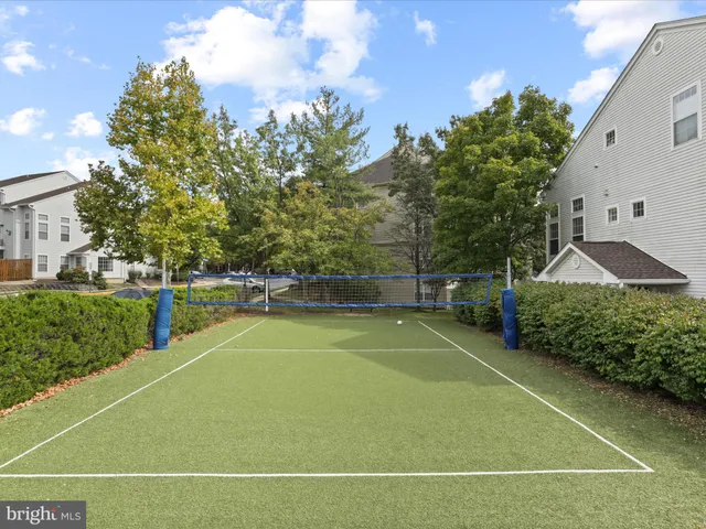 a view of a swimming pool with an outdoor seating