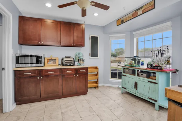 a kitchen with stainless steel appliances granite countertop a stove and cabinets