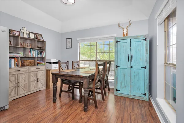 a view of a dining room with furniture window and wooden floor
