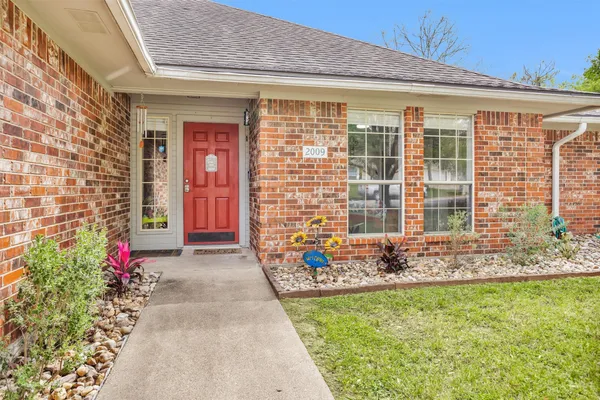 a front view of a house with a porch